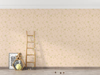Star pattern wall mural behind a wooden ladder and toys in kids room.