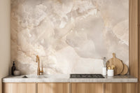 Beige stone wall mural in a kitchen setting above a wooden countertop.