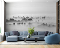 Dramatic stormy silhouettes mural for bold living room decor.
