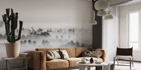 Dynamic wall mural with stormy and artistic shadow tones behind brown sofa.
