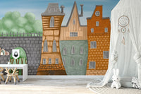 Whimsical city wallpaper mural in warm brick and pastel tones.