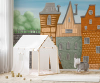 Storybook townscape wall mural with textured brick facades.