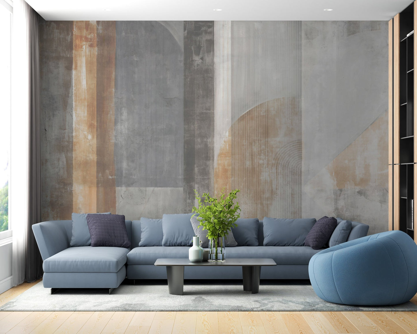 Blue sofa against a stroke pattern wall mural in a contemporary room.