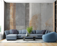 Blue sofa against a stroke pattern wall mural in a contemporary room.
