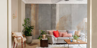 Large scale wall mural with vertical strokes in a bright living area.