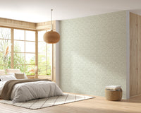 Pale green vintage damask wallpaper in bright bedroom with wooden flooring