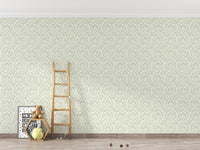 Neutral tone leaf pattern wallpaper in hallway with wooden ladder and decor