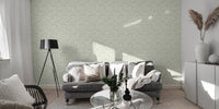 Autumn leaves wallpaper in living room with grey sofa and floor lamp