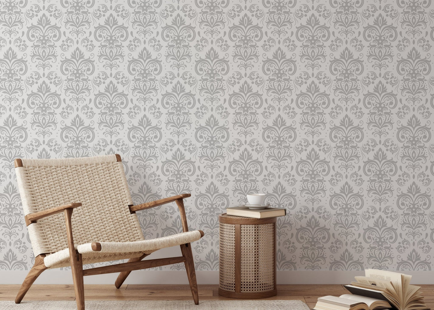 Grey and white damask wallpaper in a reading area with a wooden chair and side table.