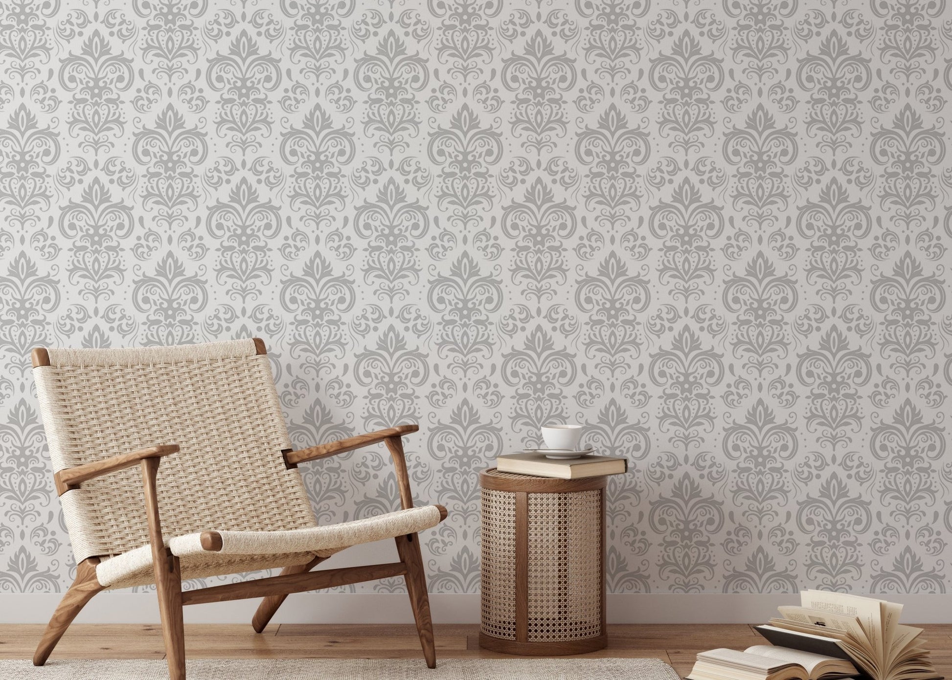 Grey and white damask wallpaper in a reading area with a wooden chair and side table.