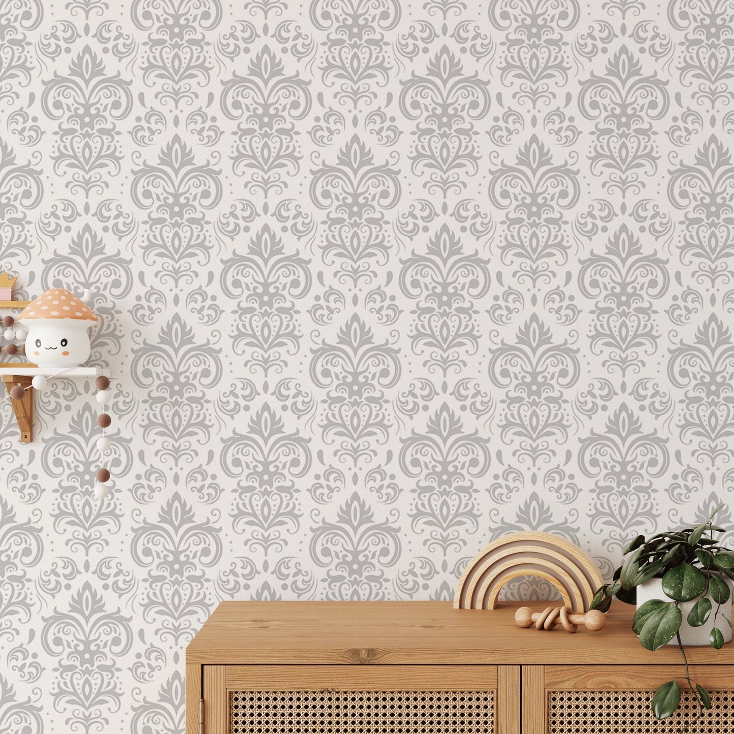 Grey patterned damask wallpaper in a playroom with wooden storage furniture.