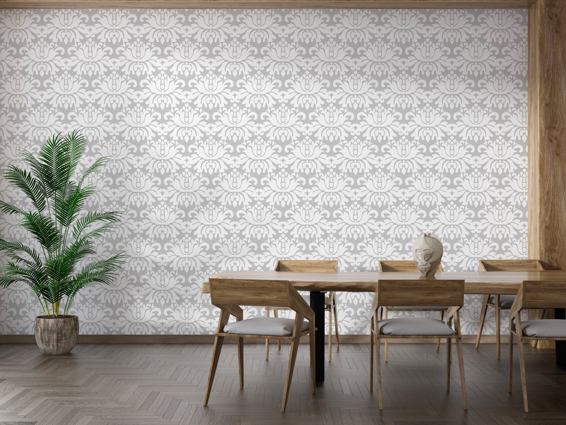 Modern dining room featuring a grey damask wallpaper behind a wooden table set.