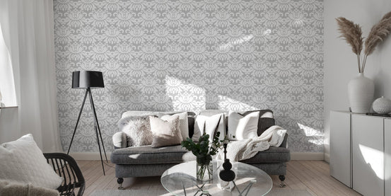 Minimalist living area featuring a light grey damask wallpaper on a large wall.