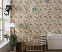 Stylized flowers and humming birds blossom garden wallpaper in a nursery with a crib.