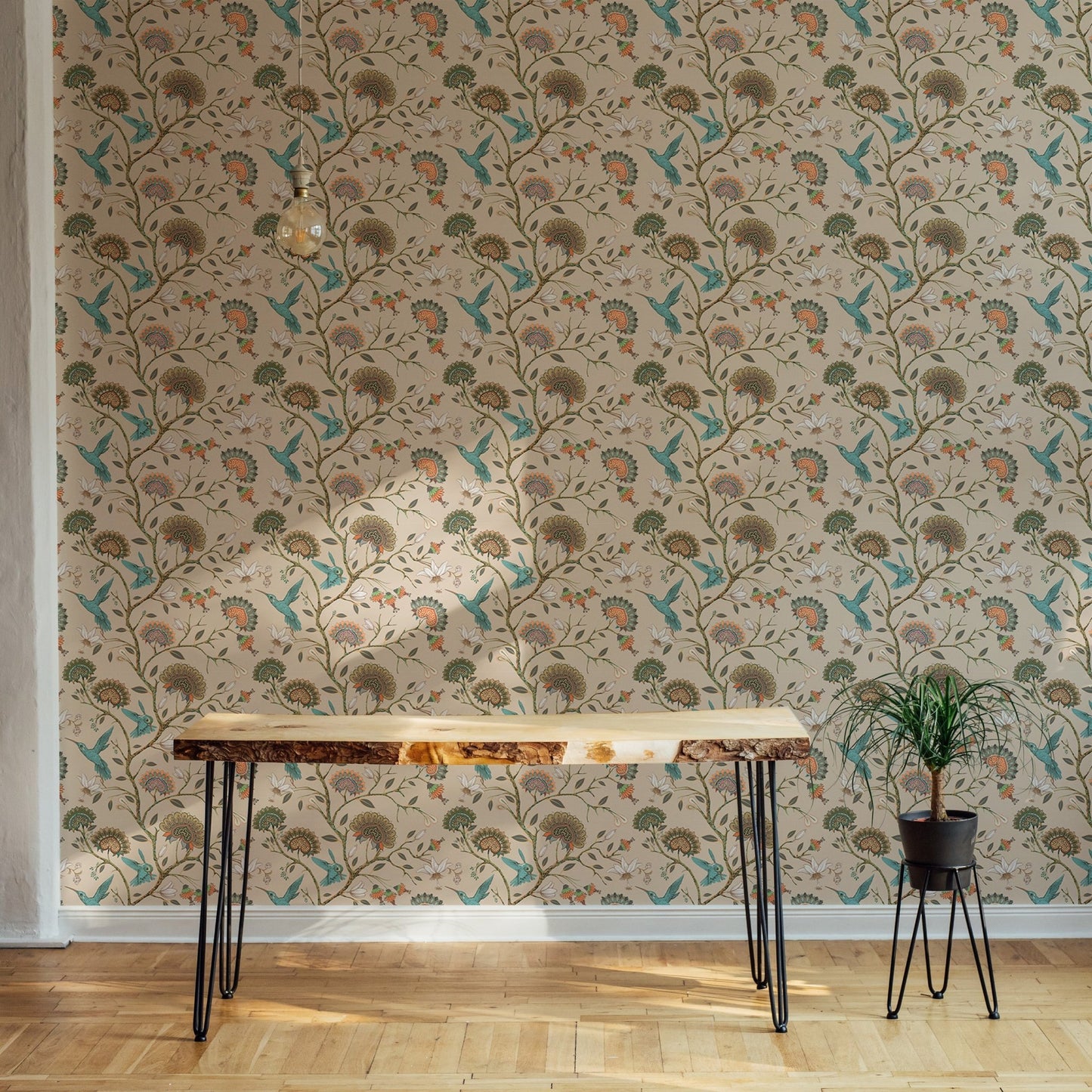 Botanical flower wallpaper behind a wooden desk in a modern home office.