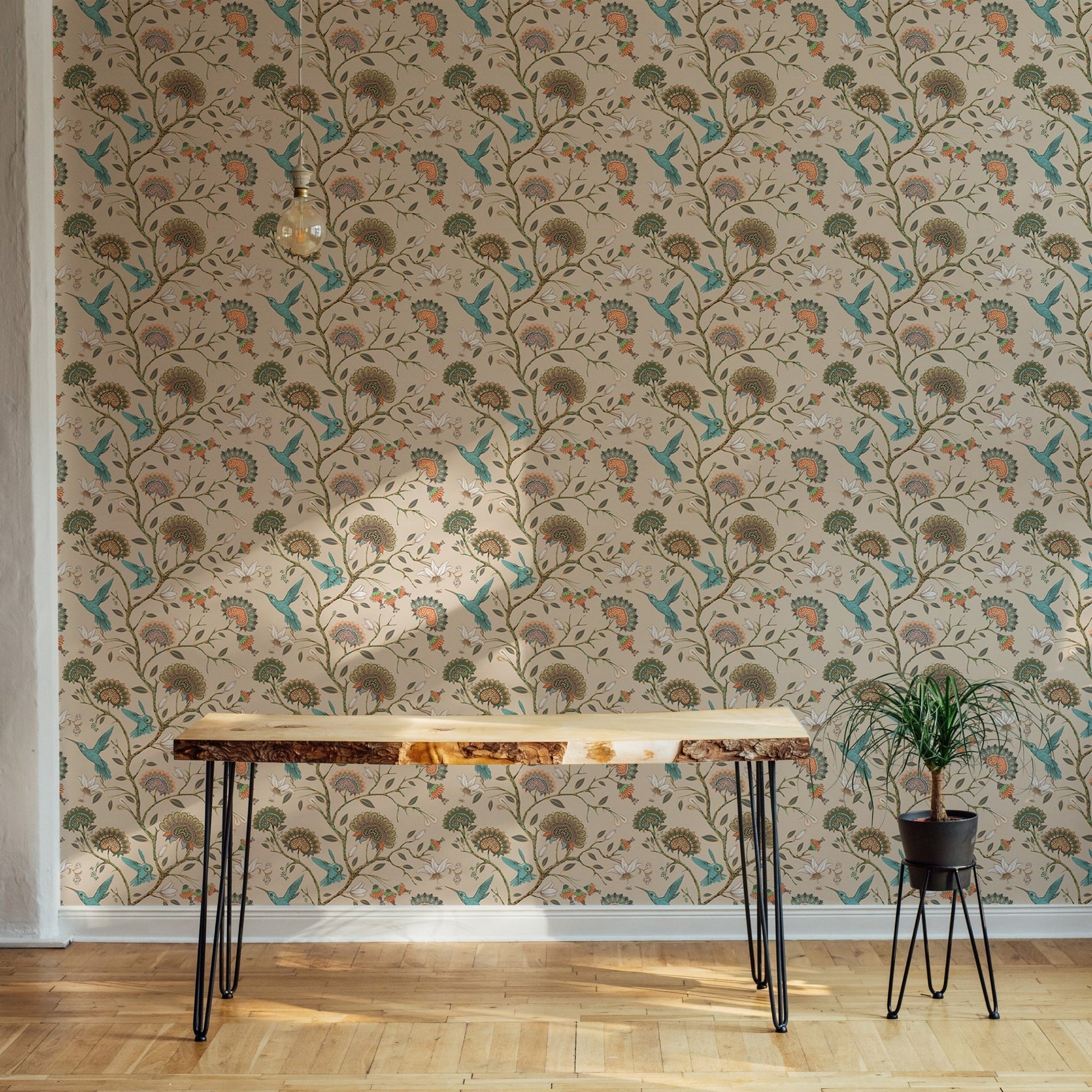 Botanical flower wallpaper behind a wooden desk in a modern home office.