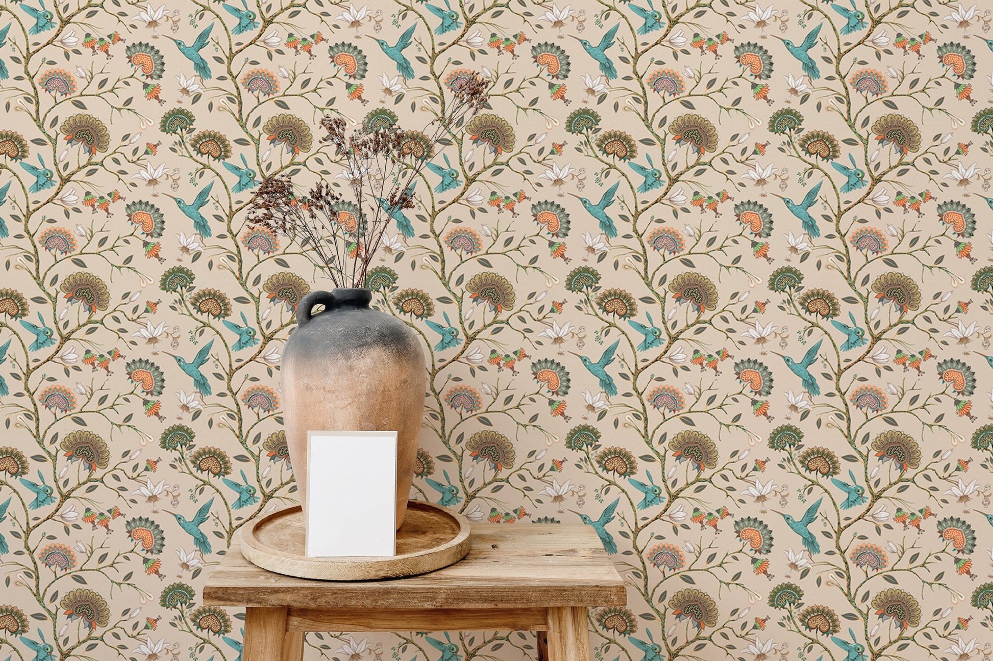 Garden themed wallpaper with teal birds and brown flowers on a neutral wall.