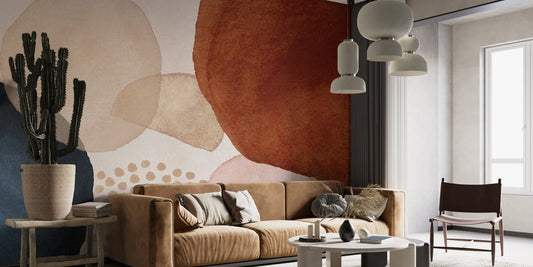 Living room with a brown leather sofa and earth tone watercolor wall mural.