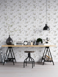Monochrome swallow bird wallpaper as a feature wall in a home office