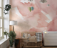 Pink watercolor waves mural adding charm to minimalist kids spaces.
