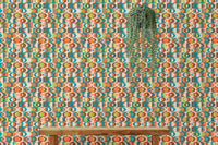 Orange and teal repeat pattern wall mural behind a wooden bench and hanging plant.