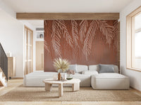 Modern terracotta wall mural in a spacious living area with a white sectional