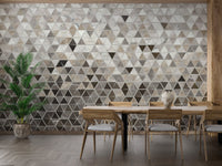 Wooden dining set with a neutral geometric marble wall mural background.
