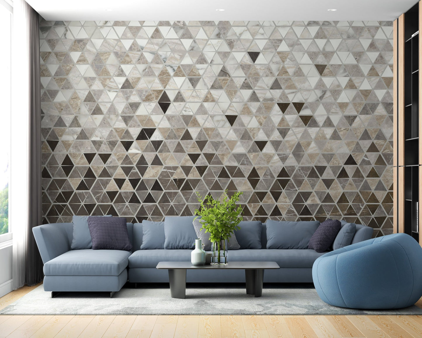 Blue sofa in a living room featuring a grey marble mosaic wall mural.