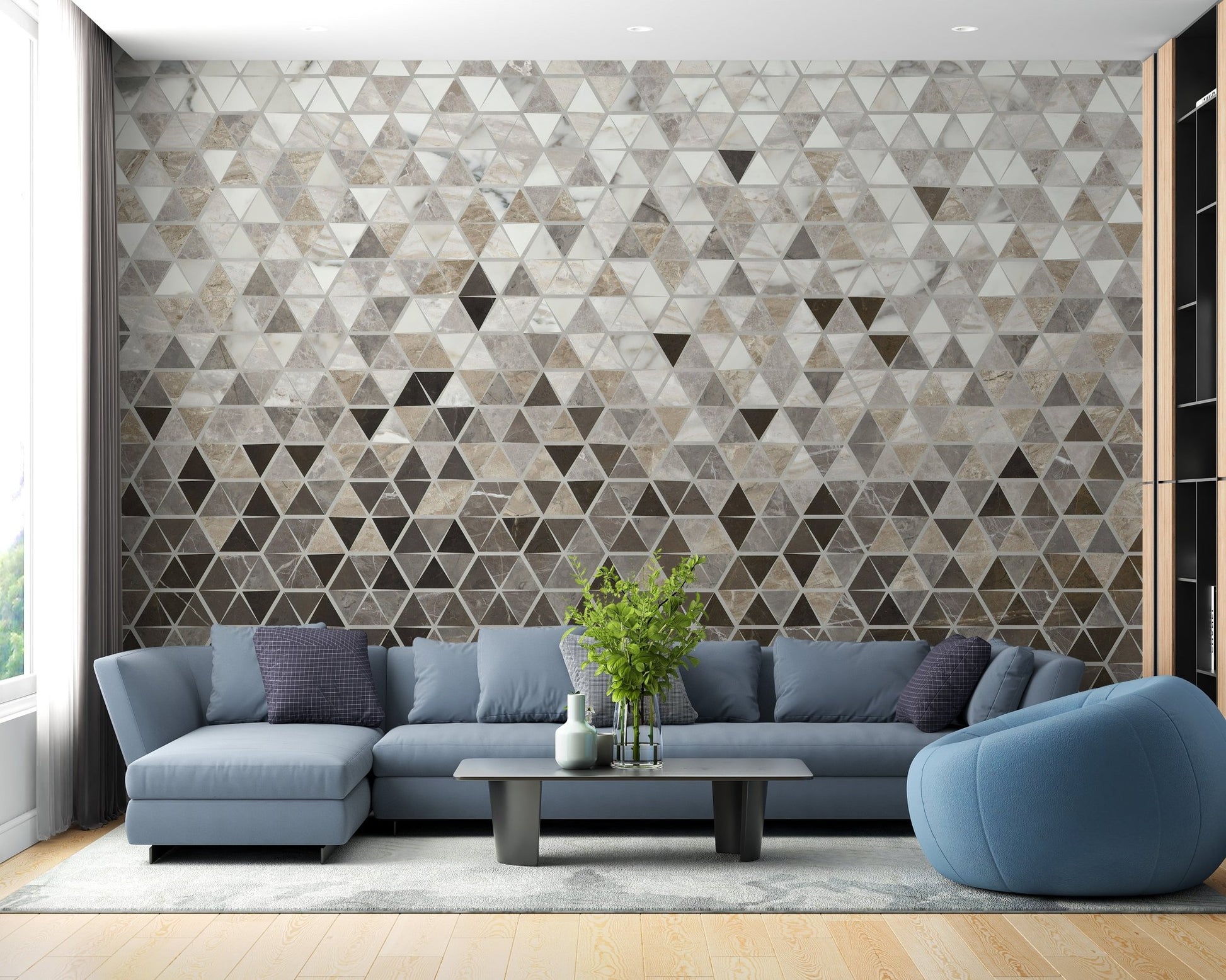 Blue sofa in a living room featuring a grey marble mosaic wall mural.