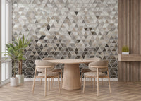 Round dining table set against a large scale marble tile wall mural.