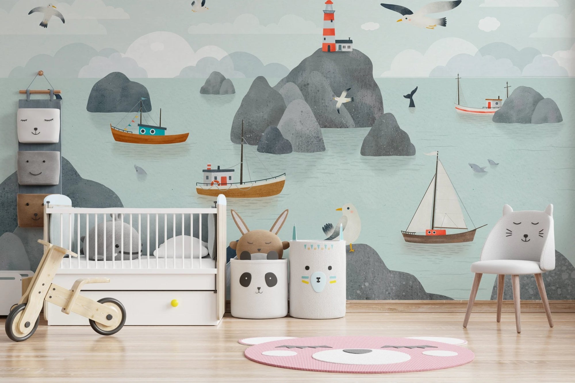Minimalist nursery with a sea themed wall mural.