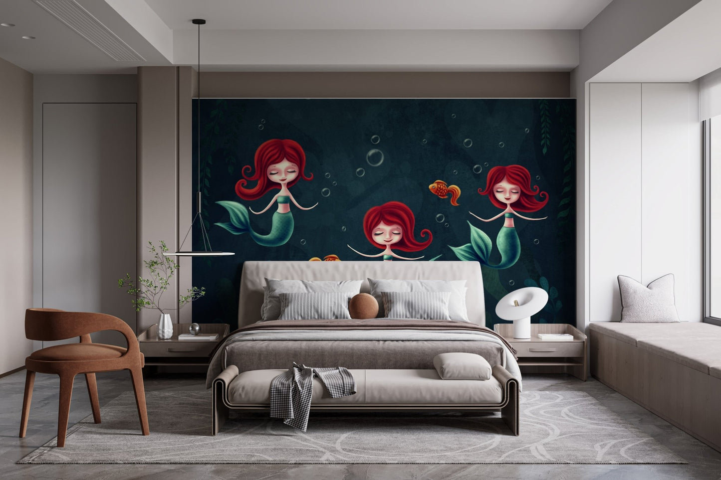 Three Underwater Mermaids Wall Mural in a bright bedroom with wooden furniture.
