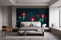 Three Underwater Mermaids Wall Mural in a bright bedroom with wooden furniture.