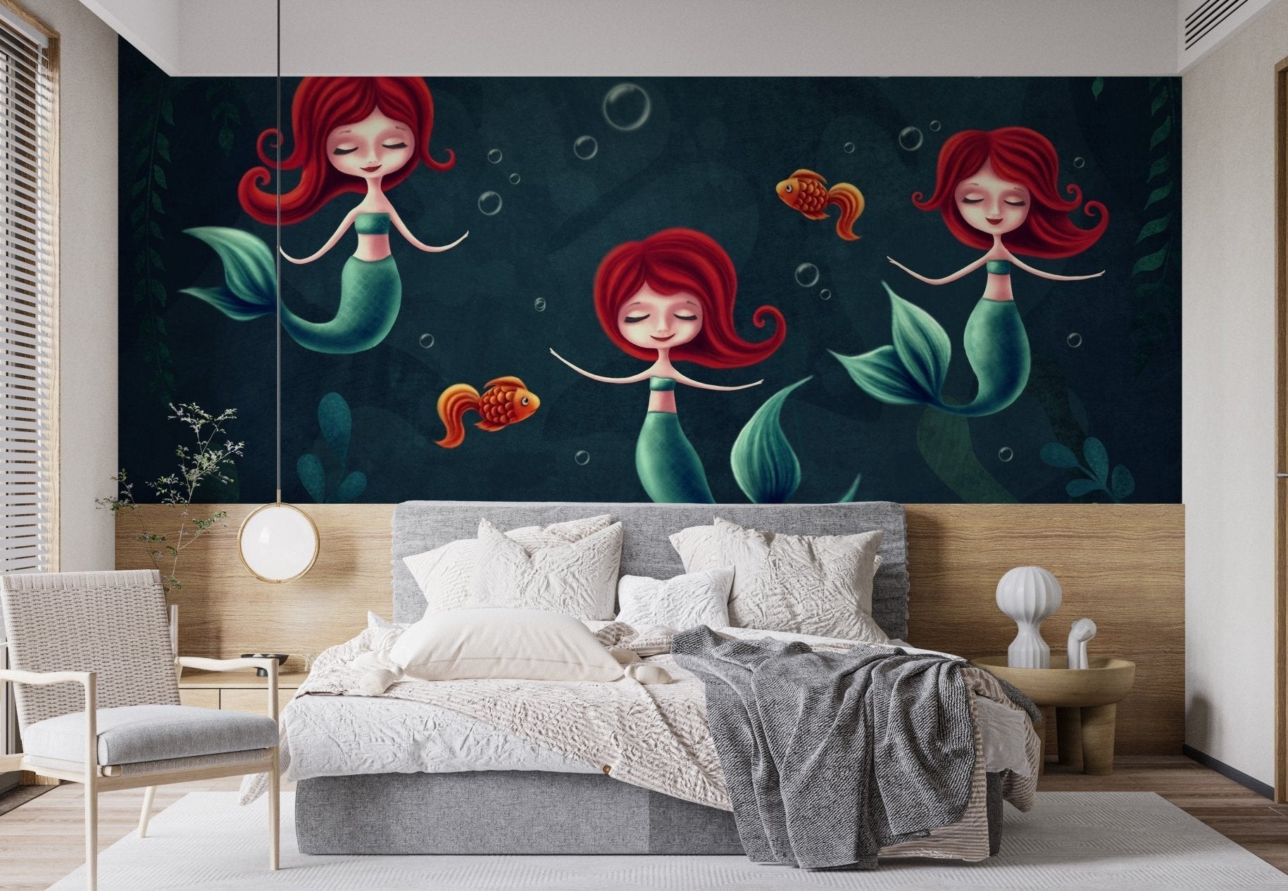 Mermaid wall mural with bubbles and fish character in a minimalist sleeping area.