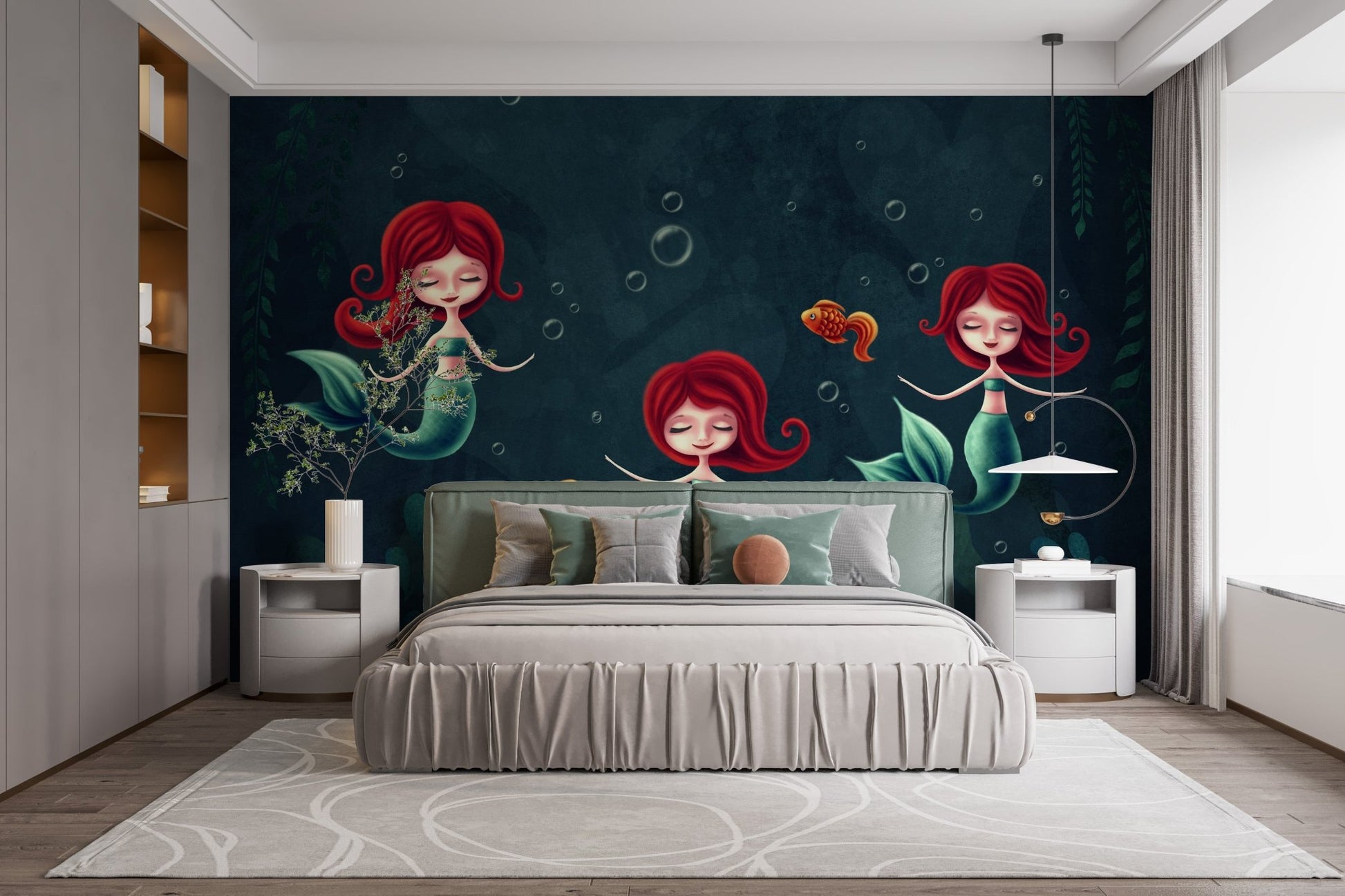Cartoon mermaid wall mural behind a large bed with white and grey pillows.