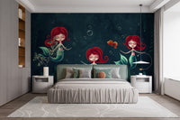 Cartoon mermaid wall mural behind a large bed with white and grey pillows.