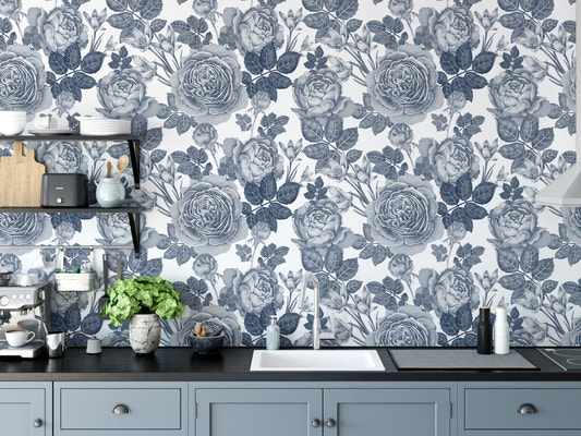Blue tinted floral wallpaper as a kitchen backsplash behind a white sink.