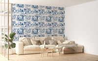 Toile De Jouy Illustration Nature Old French Wallpaper behind a beige sofa.