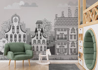 Town of Imagination Kids Wall Murals styled with a green armchair and rug.
