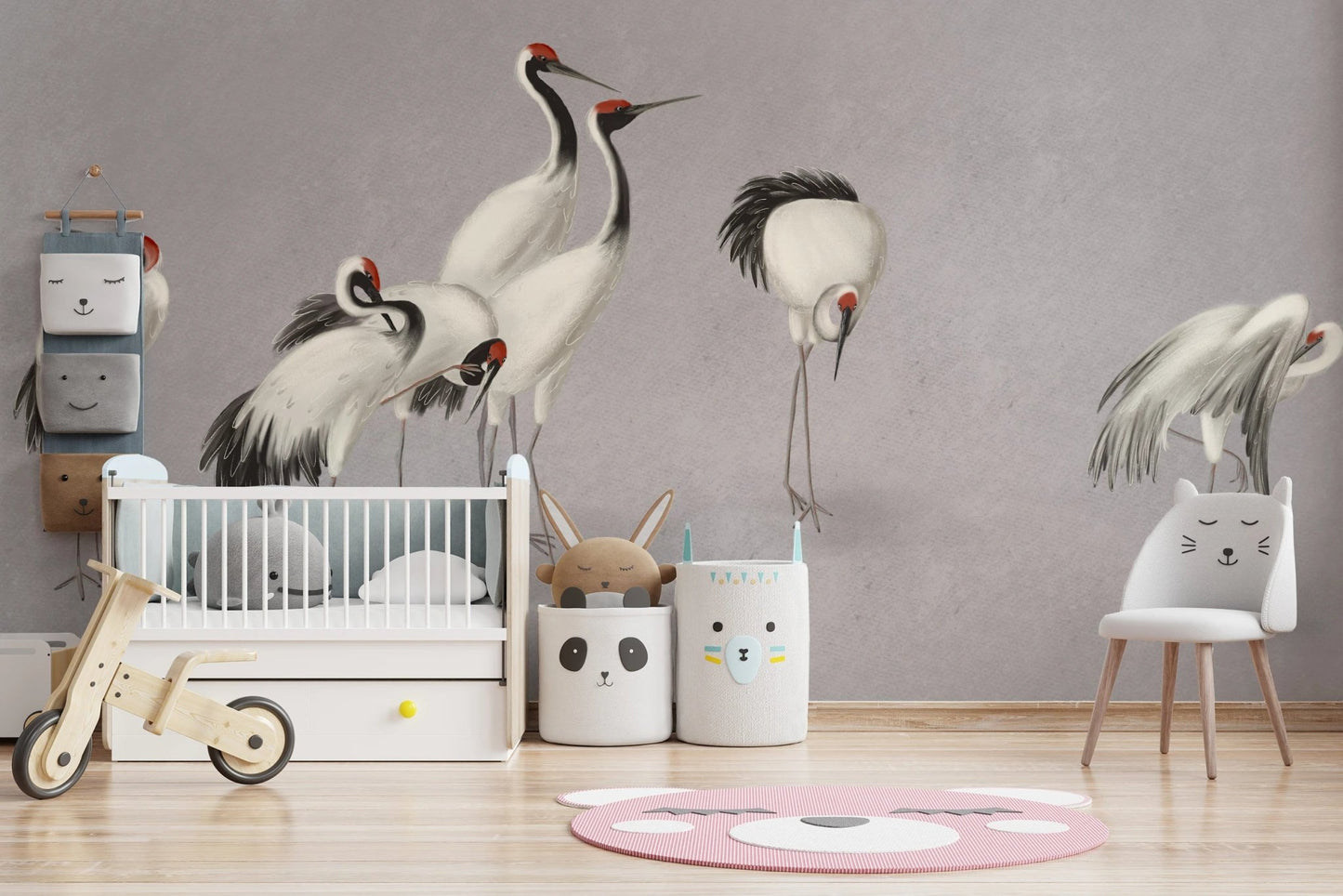 Kids' bedroom featuring a crane wall mural and a pink round floor rug.