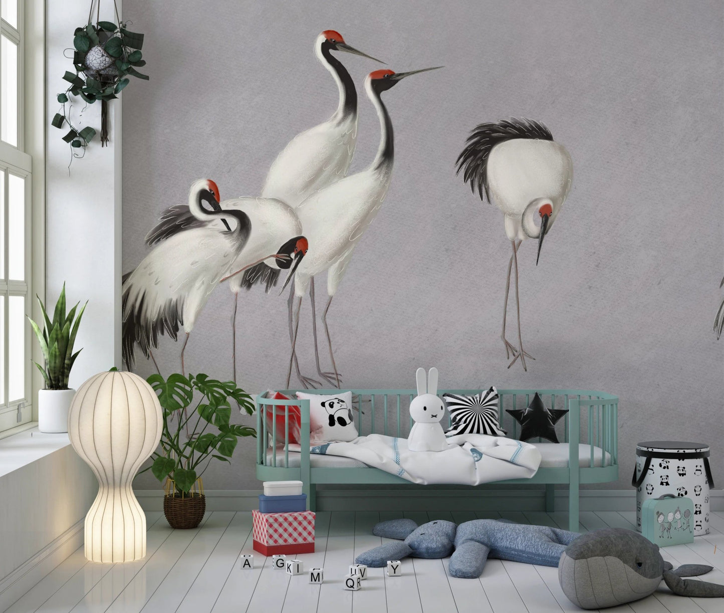 Nursery room mural featuring large standing cranes on a grey textured wall.