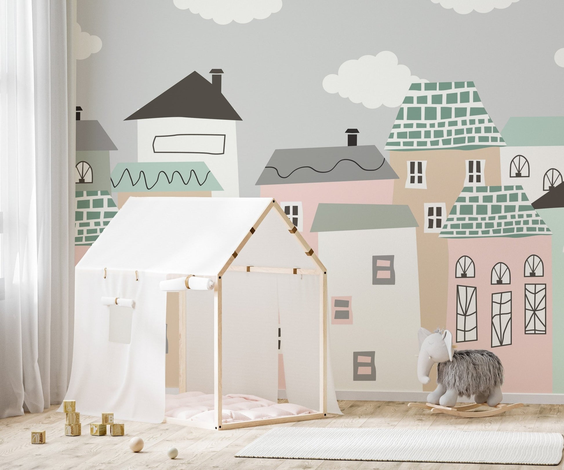 Artistic mural featuring a peaceful neighborhood landscape in kids play area.
