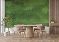 Green wall mural showcasing tranquil and earthy tones in dining room.