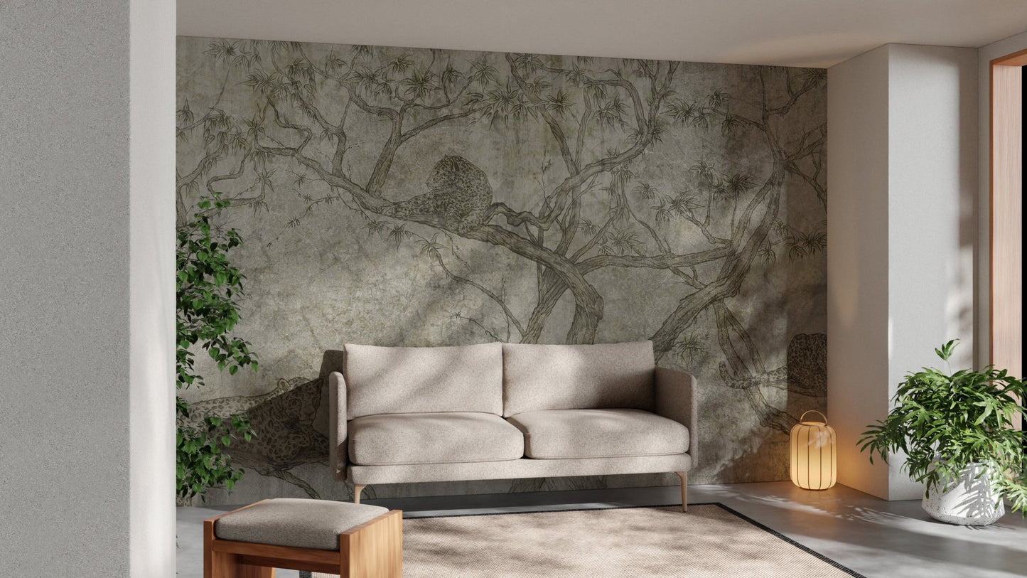 Textured sepia tree wall mural behind a cream sofa and indoor plants.