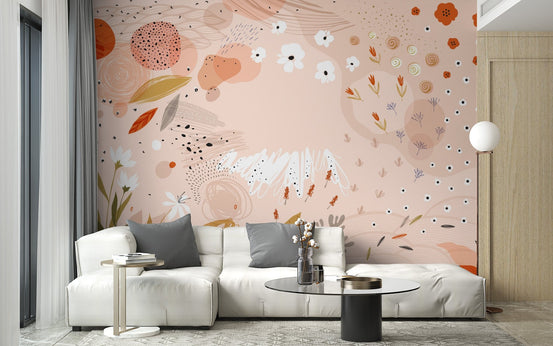 Apartment living area with white sectional and floral art wall mural.