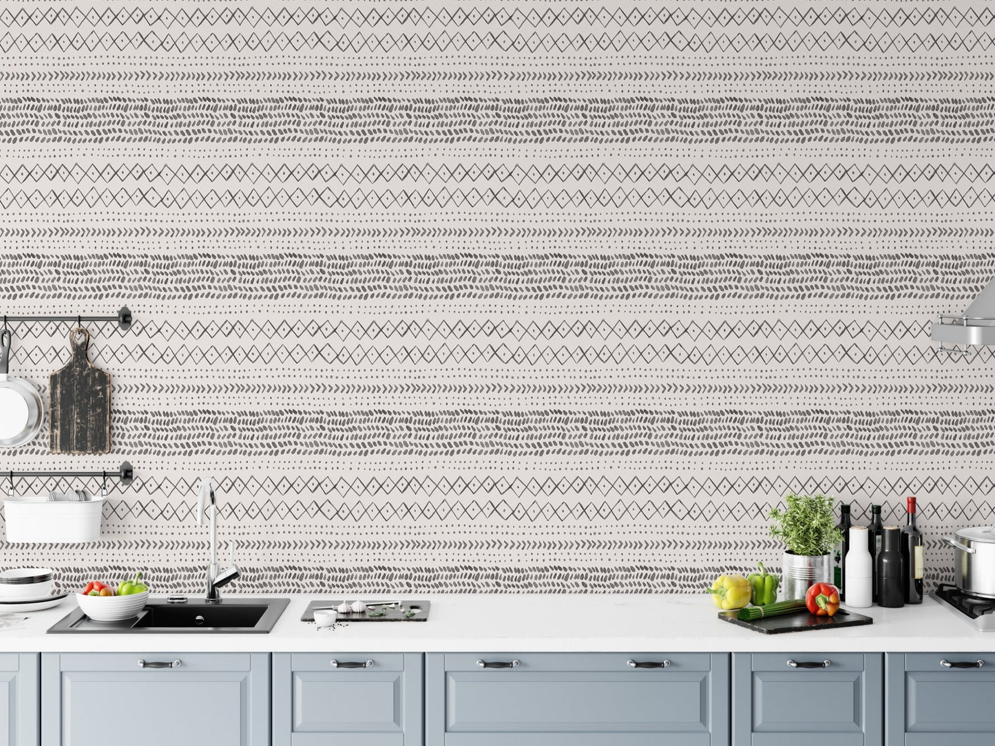Kitchen counter with blue cabinets and horizontal boho pattern wall mural.