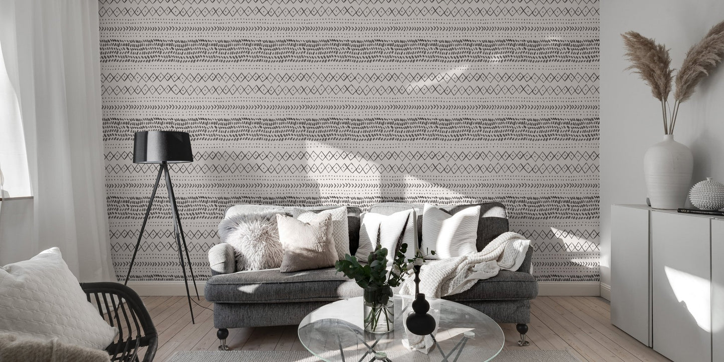 Living room with grey sofa and horizontal ethnic pattern wall mural.