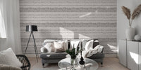 Living room with grey sofa and horizontal ethnic pattern wall mural.