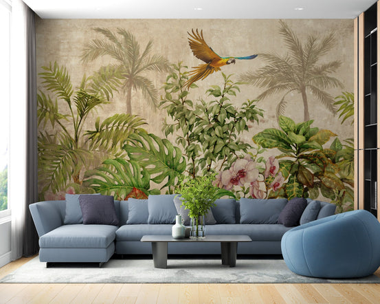 Blue sectional sofa in living room placed against a tropical forest wall mural.