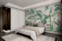 Tropical leaf wall mural with soft greens for a bedroom look.